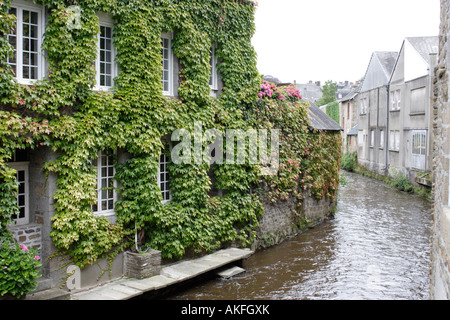 Vine covered riverside house Villedieu les Poeles La Manche Normandie France Stock Photo