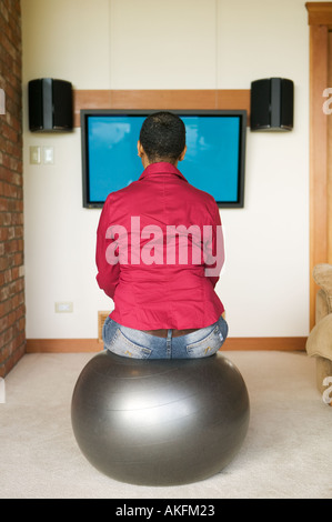 sitting on an exercise ball while watching tv