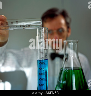 portrait of scientist working with liquids in lab editorial use only Stock Photo