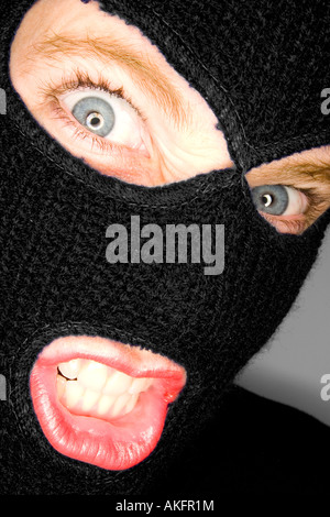 A stock photograph of an attractive woman wearing a balaclava. Stock Photo