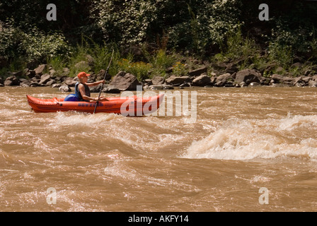 Woman kayaking on the Arkansas River in Glenwood Canyon Colorado Stock Photo