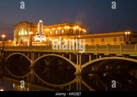 ILLINOIS Aurora Exterior of Hollywood Casino at night arches on bridge reflected in waters of Fox River Stock Photo