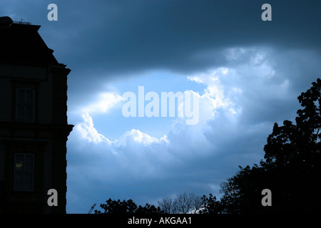 Dramatic shot of Bratislava showing rays of sunshine bursting through the oppressing clouds Stock Photo