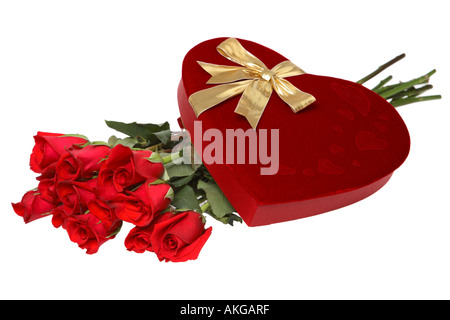 Box of Valentines Day Chocolates and a Dozen Long Stem Roses Stock Photo
