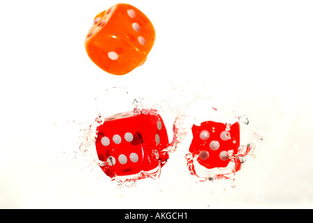 colorful dices falling in water Stock Photo