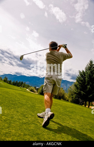 Follow through on a golfer's shot Stock Photo