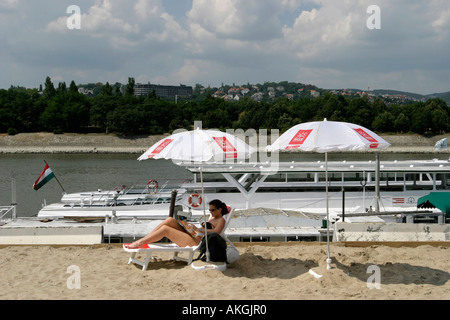 Woman relaxing along the Danube river Budapest Hungary Stock Photo