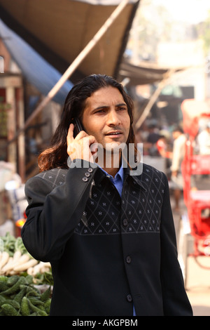A young Indian Businessman talks on his phone in Delhi, India Stock Photo
