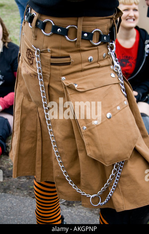 Chained kilt uniformed RollerGirl from the Roller Derby League. MayDay Parade and Festival. Minneapolis Minnesota USA Stock Photo