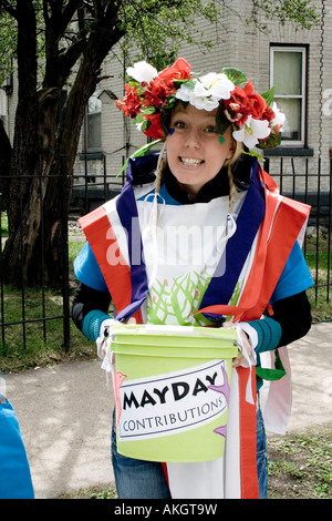 Money placed in bucket is support for the MayDay Parade and festivities. MayDay Parade and Festival. Minneapolis Minnesota USA Stock Photo