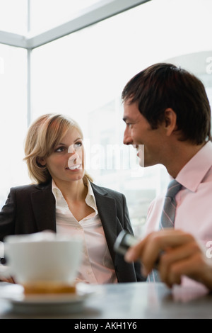 Businesswoman and businessman having coffee break Stock Photo