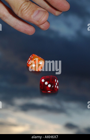hand throwing dices Stock Photo