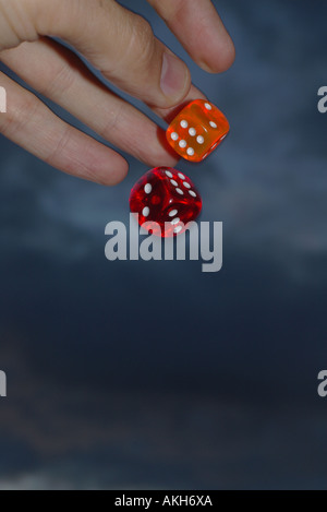 hand throwing dices Stock Photo