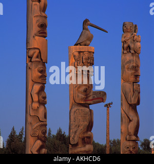 Gitksan (Gitxsan aka Tsimshian) Totem Poles at Gitanyow (Kitwancool) in Northern BC, British Columbia, Canada Stock Photo