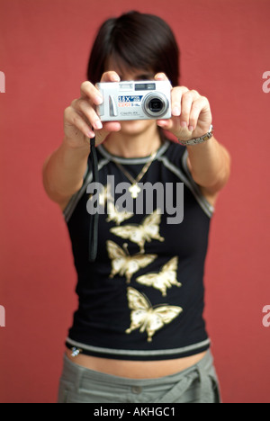 Young Woman Using a Compact Digital Camera Stock Photo