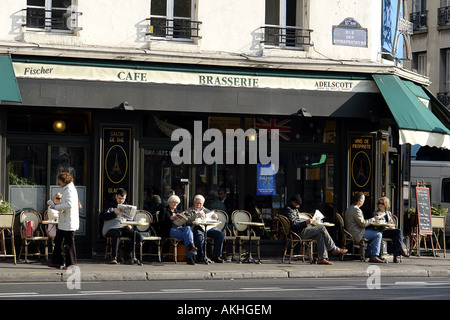 street with bistro terrace Paris France Stock Photo