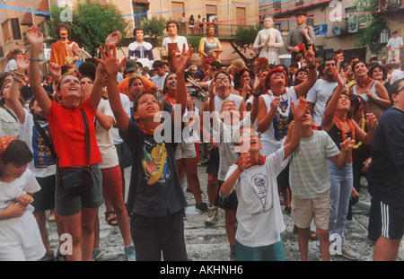 Children call out for sweets,Les Festes de la Bisbal, La Bisbal , Catalonia , Spain Stock Photo