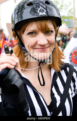 Happy Minnesota RollerGirl of Roller Derby League age 27 wearing uniform. MayDay Parade and Festival. Minneapolis Minnesota USA Stock Photo