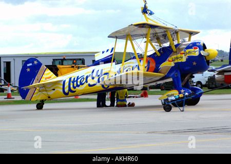 Wing walking on this 1930s bi- plane called Utterly Butterly. Stock Photo