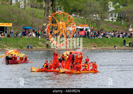 Flotilla paddling sun across Lake Powderhorn for Tree of Life Ceremony. MayDay Parade and Festival. Minneapolis Minnesota USA Stock Photo