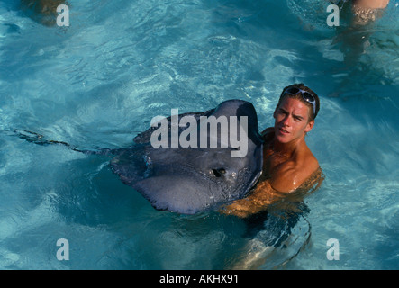 adult man holding South Atlantic Stingray, South Atlantic Stingray, Atlantic Stingray, Stingray City, Grand Cayman Island, Cayman Islands, Caribbean Stock Photo