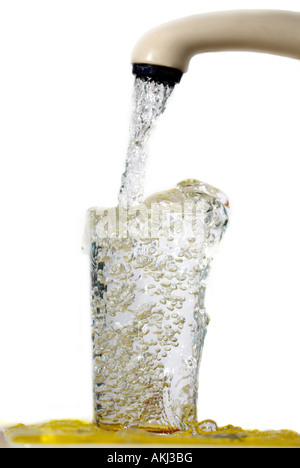 Filling a glass of water from a tap Stock Photo