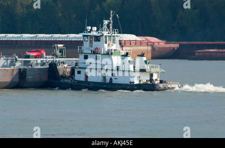 Tugboat pushing barge on the Mississippi River New Orleans LA USA Stock Photo