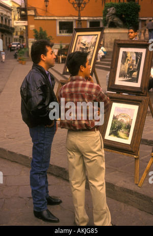 Mexicans, Mexican men, vendor, art fair, selling paintings, paintings for sale, artwork, Guanajuato, Guanajuato State, Mexico Stock Photo