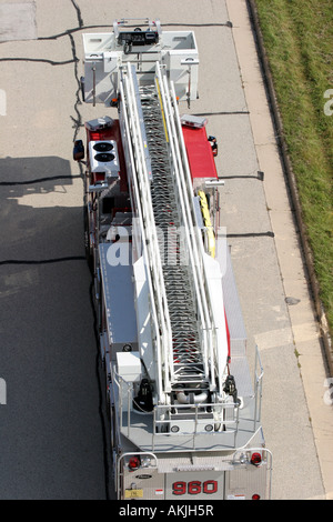 A ladder fire truck leaving an emergency scene Stock Photo