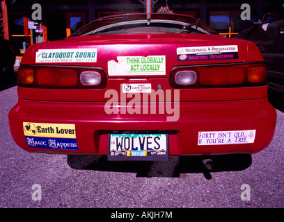 Environmental Bumper Stickers on a Red Car Stock Photo