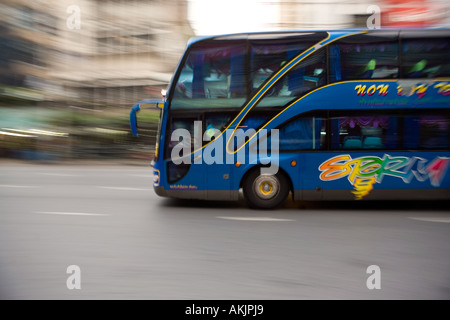 Air conditioned bus carrying tourist in Bangkok, Thailand Stock Photo