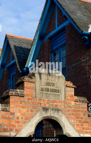 In the centre of Padstow Cornwall are these beautiful redbrick Victorian almshouses Stock Photo