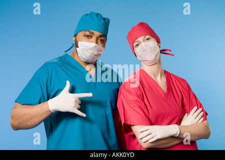Two doctors wearing scrubs Stock Photo