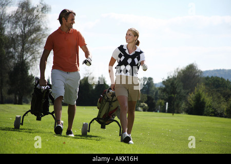 couple on the golf course Stock Photo