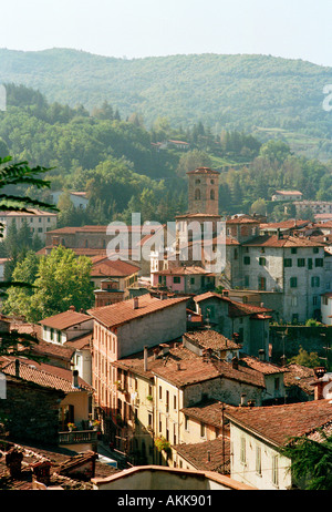 A view over an old Tuscan hill village in Italy showing the typical red tiled roofs Stock Photo