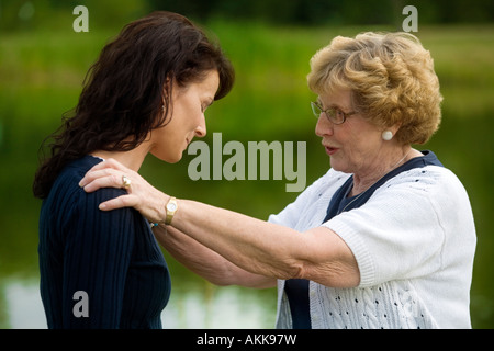 Senior woman consoling her daughter Stock Photo