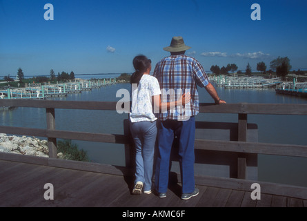 Couple at Empty boat Harbor Stock Photo
