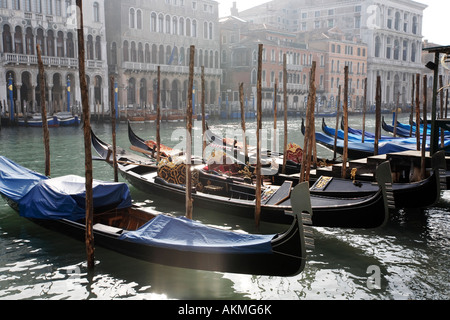 Gondolas moored on the Grande Canal in Venice, Italy in February.