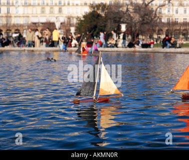 Toy sailing boats on the water of a fountain in the Tuilleries of Paris Stock Photo