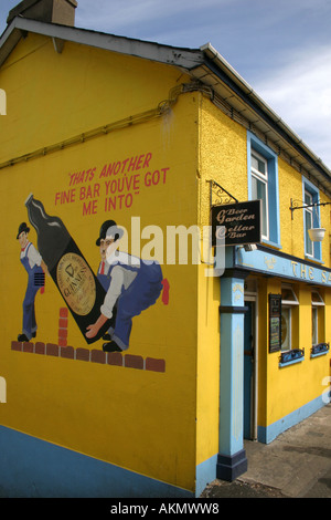 Guinness advert on side wall of pub in Waterfoot, County Antrim, Northern Ireland Stock Photo