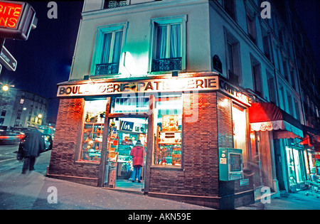 Old French Bakery Shop Paris France  Boulangerie Patisserie Exterior 'Old Storefront' Lit up Outside at Night, vintage French photos Stock Photo