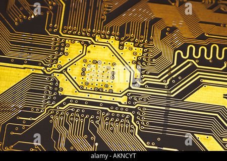 Close up photograph of gold coloured digital computer circuit board Stock Photo