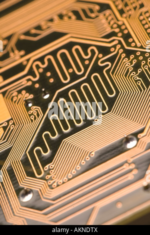 Close up photograph of copper coloured digital computer circuit board Stock Photo