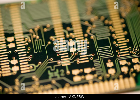 Close up photograph of computer circuit board gold connectors and circuits Stock Photo