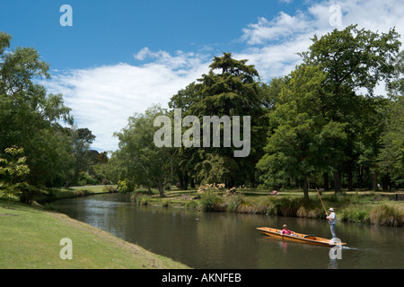 Couple punting on the Avon River in the Botanic Gardens, Christchurch, South Island, New Zealand Stock Photo