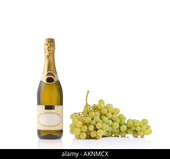 Champagne bottle and grapes Stock Photo