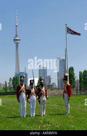 Redcoat soldiers practicing marching at Old Fort York Toronto with CN Tower and city skyline Stock Photo