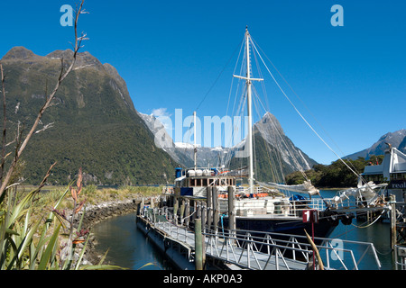 Cruise Boat with Mitre Peak behind, Milford Sound, Fiordland National Park, South Island, New Zealand Stock Photo