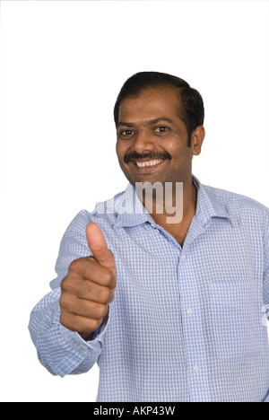 Mature Indian man thumbs up Stock Photo