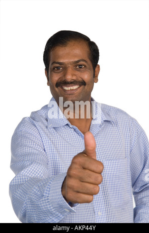 Mature Indian man thumbs up Stock Photo